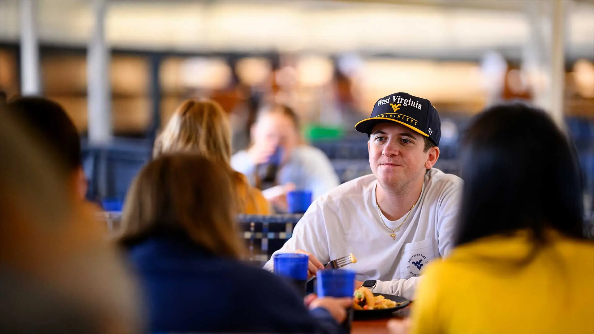 Students enjoying a meal in a dining room