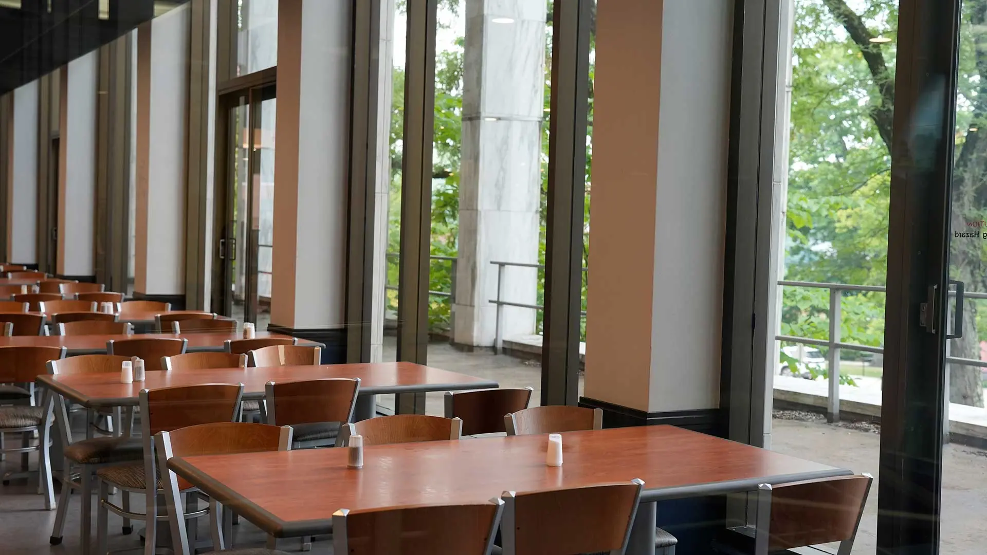 Tables and chairs in an empty dining hall