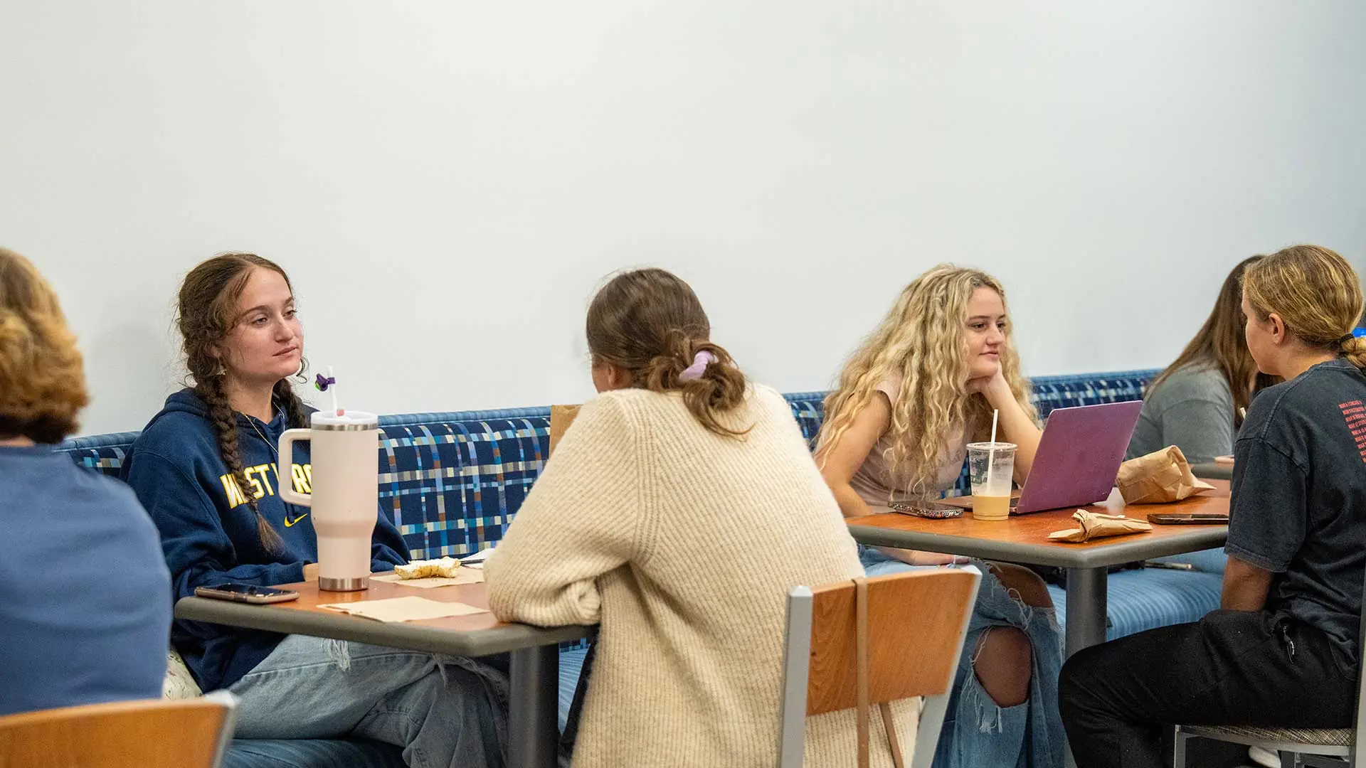 Student eating at a cafeteria table